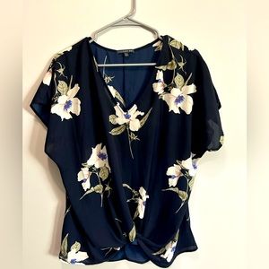 NWOT. Flowy navy floral short sleeve shirt with tie front detail